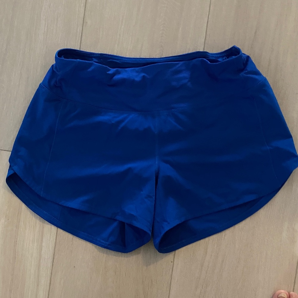 Women's royal blue mid-rise speed up shorts 4”, size 6